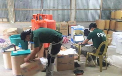<p><strong>DISMANTLED. </strong>PDEA personnel inspect controlled precursors and essential chemicals found in a shabu laboratory inside a farm in Ibaan, Batangas on Thursday (April 12, 2018). <em>(Photo courtesy: PDEA-Public Information Office)</em></p>